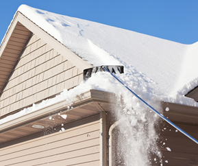 using a snow rake on roof