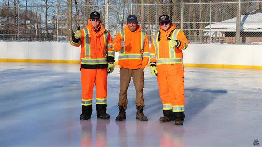 Staff standing on outside rink